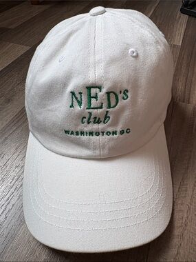 The Classic White Baseball Cap with Green Embroidered 'NED's club'
